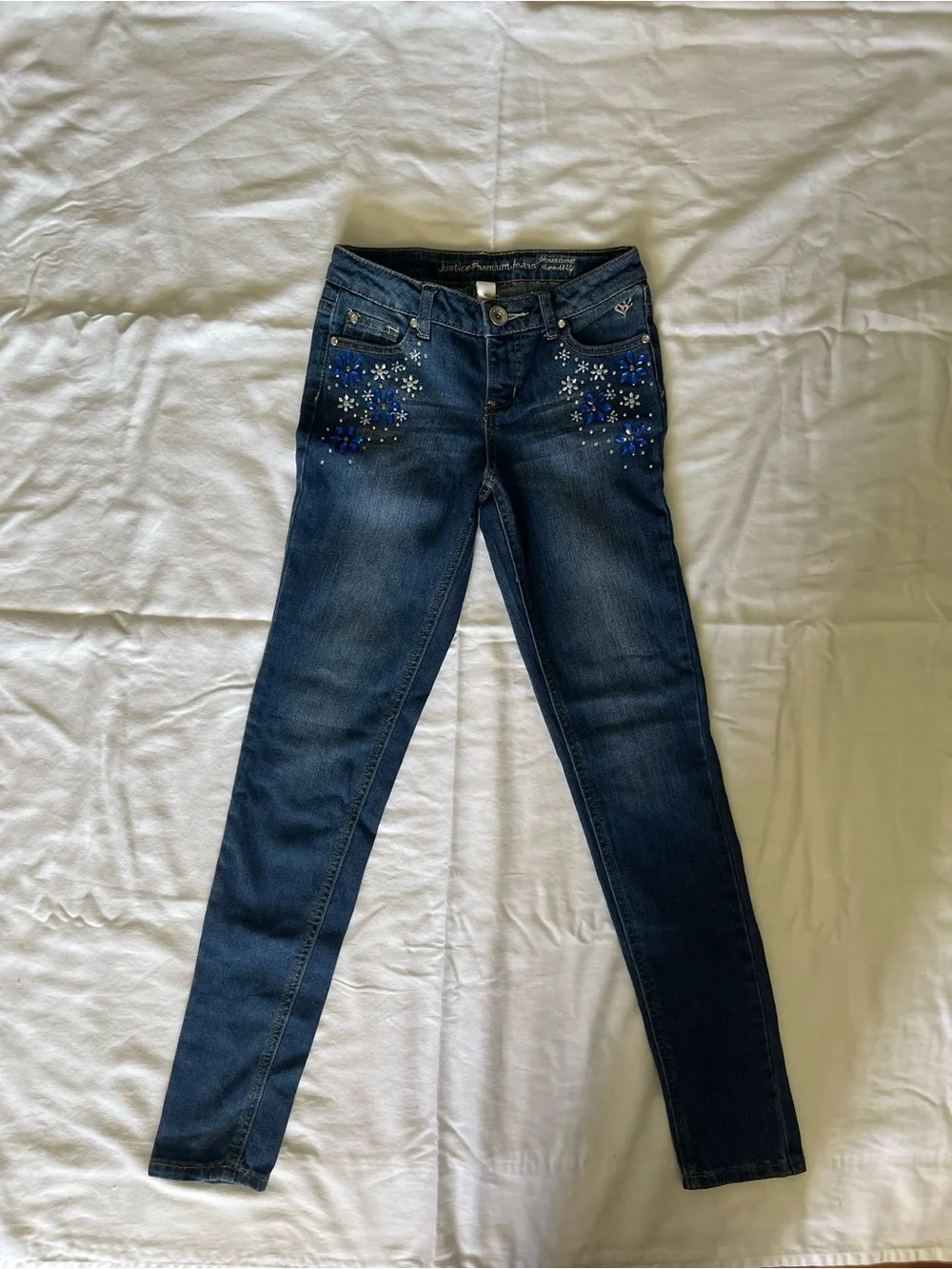Justice Dark Blue Skinny Jeans with Blue Floral Embellishments